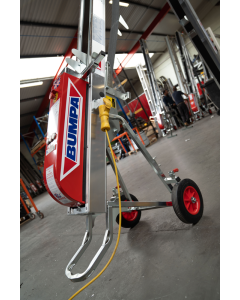 Red Bumpa Electric Tile Hoist with red wheels and yellow power cord, positioned inside a warehouse. 