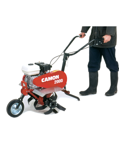 Person in wellington boots using a red Camon C2000 Cultivator with a Honda engine, metal tine guards and a front wheel. 