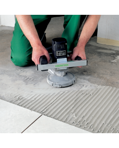 Person in green trousers using an Eibenstock Diamond Surface Grinder on a floor surface. 